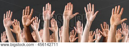 Crowd Raising Hands High Up On Gray Background