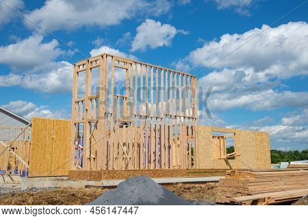 Installiation Of The Frame And Walls Of A Plywood House Plank Lumber Construction