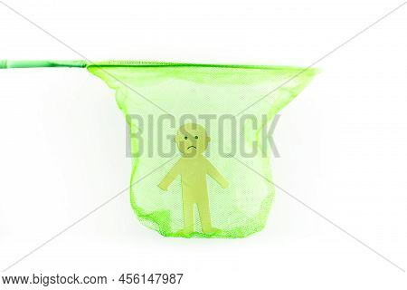 Photo Of Concept Of Child Rights Violation In Form Of Paper Cut Sad Man Located Inside Green Net, Wh