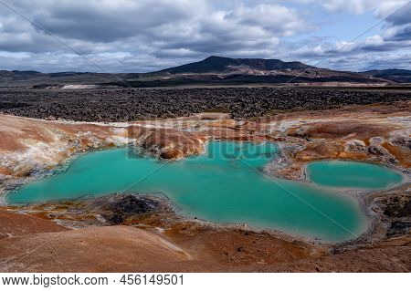 Beautiful Colourful Icelandic Landscape Lava Fields Mountain Geysers Zigzag Road And Moss-covered St