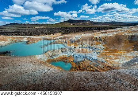 Beautiful Colourful Icelandic Landscape Lava Fields Mountain Geysers Zigzag Road And Moss-covered St