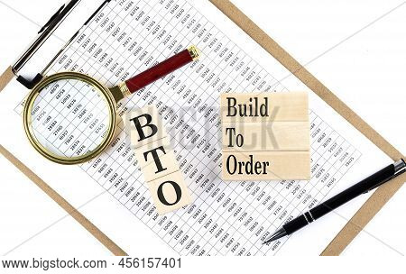 Bto Build To Order Text On A Wooden Block On Chart Background