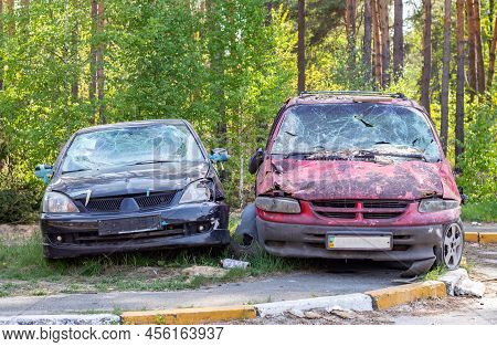 A Car Destroyed By Shrapnel From A Rocket That Exploded Nearby. Irpensky Automobile Cemetery. Conseq