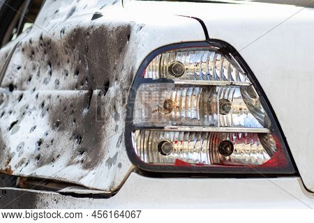 Shot, Damaged Cars During The War In Ukraine. The Vehicle Of Civilians Affected By The Hands Of The