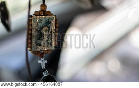 Wooden Icon Amulet In The Car Of Nicholas The Wonderworker On A String Double Sided. The Icon Is Con