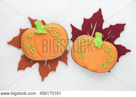 abstract background with gingerbread in the shape of a pumpkin for halloween or  thanksgiven day, selective focus