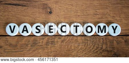 Vasectomy Symbol. Concept Words Vasectomy On White Circles. Beautiful Wooden Table Wooden Background