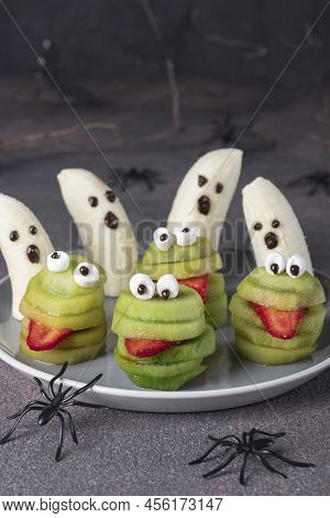 Spooky Banana Ghosts Monsters And Green Kiwi Monsters For Halloween Party On Brown Background Decora