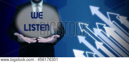 Handwriting Text We Listen. Word Written On Group Of Showing That Is Willing To Hear Anything You Wa