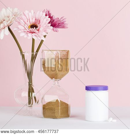 Women Health, Middle Age And Menopause Concept. Health Care Style. Copy Space. White Plastic Bottle 