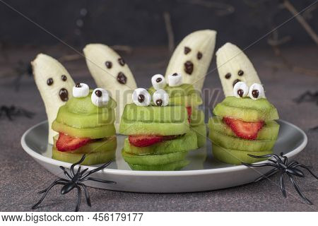 Spooky Banana Ghosts Monsters And Green Kiwi Monsters For Halloween Party On Brown Background Decora