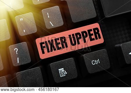 Text Sign Showing Fixer Upper. Word Written On House In Need Of Repairs Used Chiefly Connection With