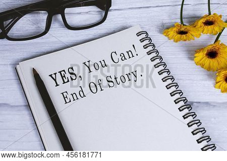 Motivational Quote On Notepad With Sunflowers On Wooden Desk - Yes You Can, End Of Story.
