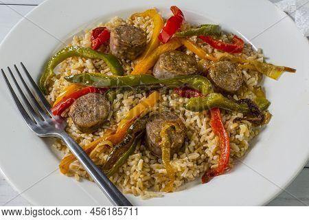 Brown Rice With Sauteed Onions And Peppers Top Witr Sausages