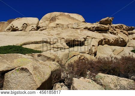 Volcanic Rocks In Bektau-ata Trackt With Huge Stones Against The Blue Sky In Summer. Huge Stones, St