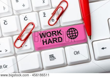 Hand Writing Sign Work Hard. Conceptual Photo Laboring That Puts Effort Into Doing And Completing Ta