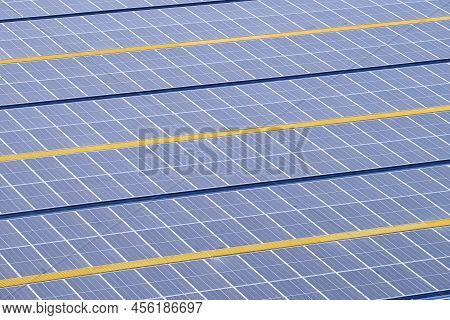 Solarcell Panel Installed On The Roof Of A Factory To Produce Clean Energy From The Sunlight