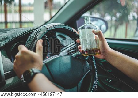Man Drinking Alcohol While Driving In His Car