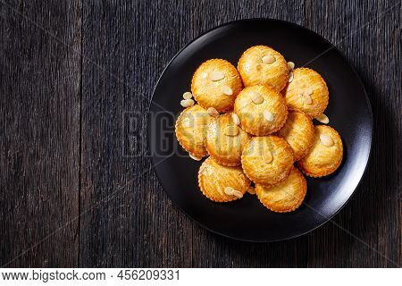 Almond Cookies Filled With Marzipan And Almonds Nuts Paste, Gevulde Koek, On Black Plate On Dark Woo