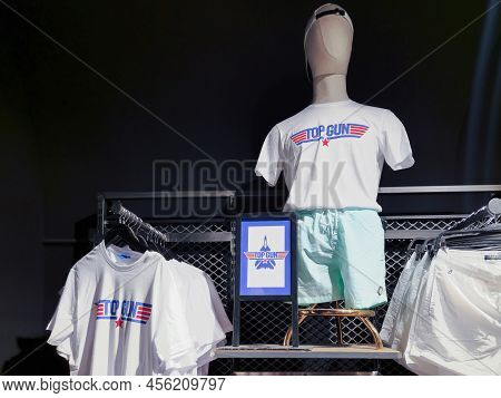 Naples, Italy - June 03 2022: Top Gun Maverick Movie T-shirt Clothing With Logo At Interior Showcase