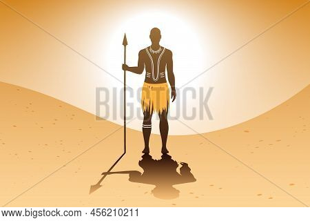 Aborigine Man With Body Art And Ethnic Dress, Standing On A Sandy Background, And Holding A Spear.