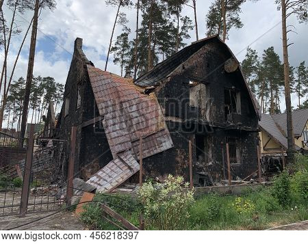 A Burned-out Private House From An Artillery Shell Hit. Housing Damaged As A Result Of Military Aggr