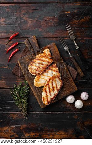 Classic German Or Austrian Schnitzel, On Old Dark  Wooden Table Background, Top View Flat Lay, With 