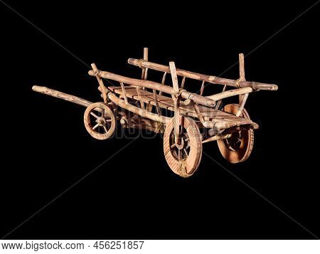 Old wooden cart model for agriculture purpose isolated on black