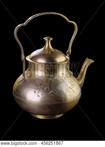 Antique silver teapot isolated on black background