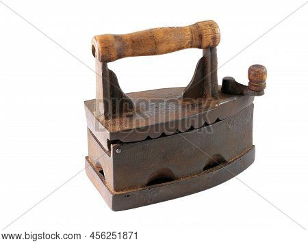 An old rusty charcoal iron isolated on a white background