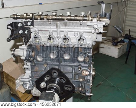 View From The Side Of The Exhaust Manifold Mounting On A Partially Disassembled Automobile Internal 