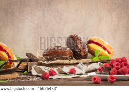 Bolas De Berlim, Or Berlin Balls. Portuguese Fried Dough With Sugar, Filled With Chocolate Or Raspbe