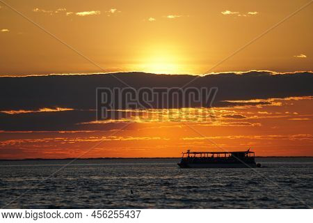 Silhouette Of A Boat Overlooking The Beautiful Sunset Near Cape Henlopen State Park, Lewes, Delaware
