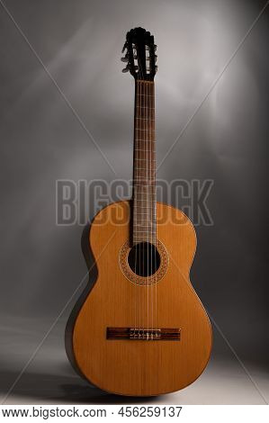Classical Guitar On A Grey Background  With Copy Space