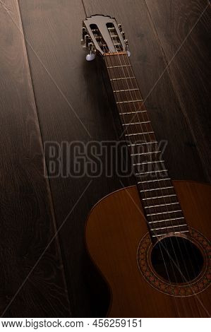 Low Key Classical Guitar On A Dark Wood