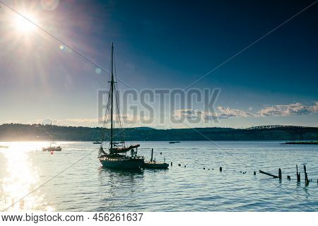Beacon, Ny - Usa - June 11, 2022 Horizontal View Of A Sail Boat Silhouette At Sunset, Moored At The 