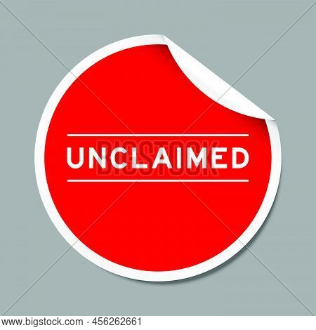 Red Color Peel Sticker Label With Word Unclaimed On Gray Background