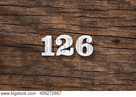 Number 126 In Wood, Isolated On Rustic Background