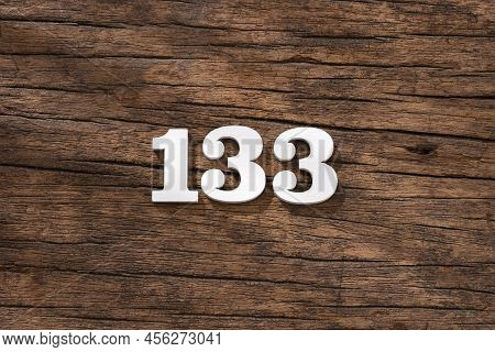Number 133 - Piece On Rustic Wood Background