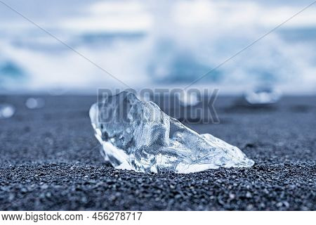 Close-up Of Beautiful Ice Chunk On Black Sand Shore Of Diamond Beach