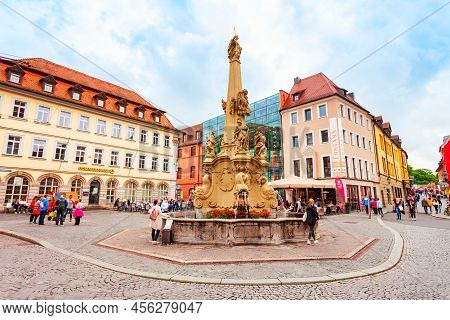 Wurzburg, Germany - July 11, 2021: Vierrohrenbrunnen Fountain In Wurzburg Old Town. Wurzburg Or Wuer
