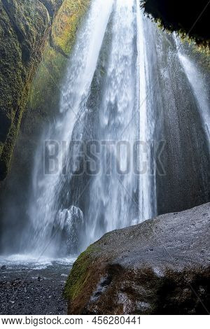 Beautiful Cascades Of Gljufrafoss Flowing From Mountain Hidden In Cliffs