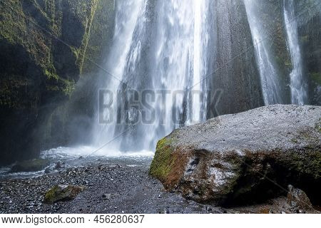 Scenic Cascades Of Gljufrafoss By Rock Flowing From Mountain Hidden In Cliffs