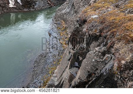 High Angle View Of Stream Flowing By Basalt Columns Formation At Eastfjords