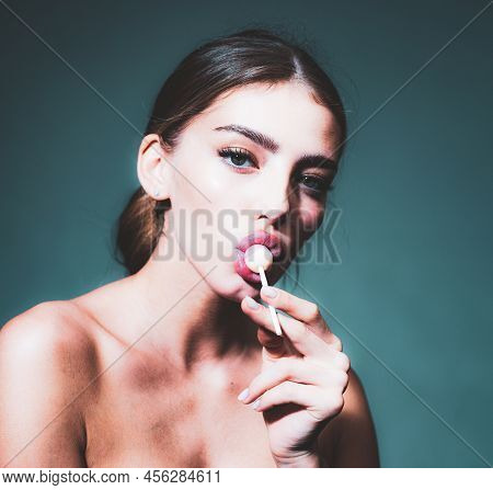 Sexy Girl Lick Lollipop. Sweets Oral Tongue. Sensual Young Woman Suck Candy. Red Lirs With Lipstick.