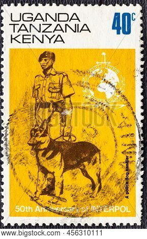 Kenya Uganda Tanzania - Circa 1973: A Stamp Printed In Kenya Uganda Tanzania Shows Interpol Emblem, 
