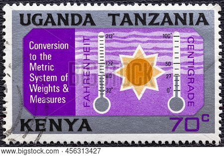 Kenya Uganda Tanzania - Circa 1971: A Stamp Printed In Kenya Uganda Tanzania Shows Conversion From F