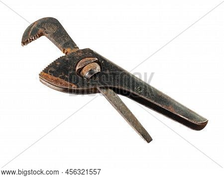 Old rusty adjustable wrench isolated on white