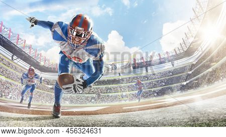 Touchdown In Football. Young Agile American Football Player Running Fast Towards Goal Line. Sportsma