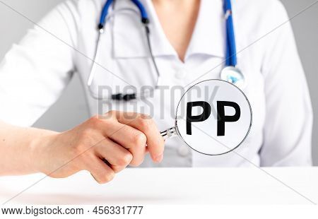 Pp Vitamin, Word Acronym Through Magnifying Glass. High Quality Photo